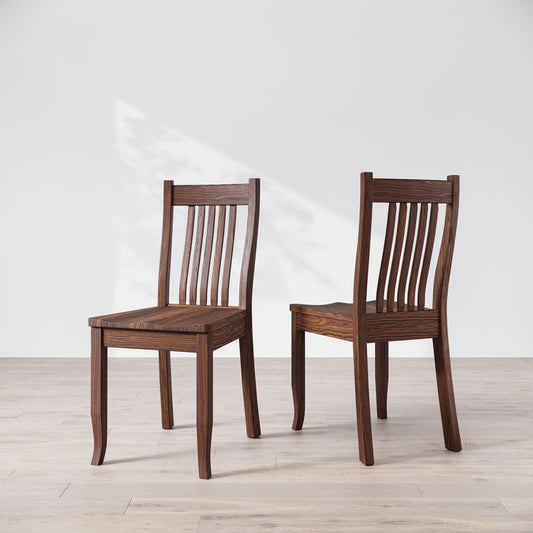 Two brown wooden dining chairs, one facing forward and the other showing the side profile.
