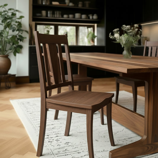 Wooden dining table with chairs in a cozy room setting