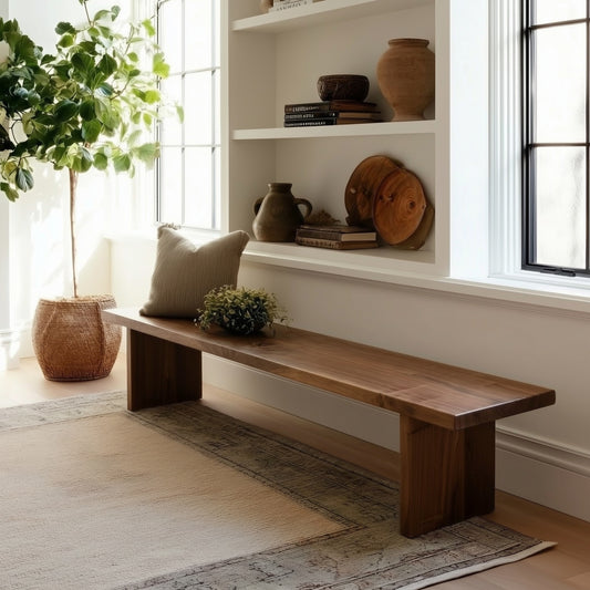 Wooden bench in a room with plants and natural light