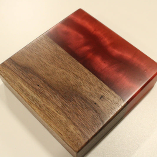walnut wood and epoxy sample in a bright red color