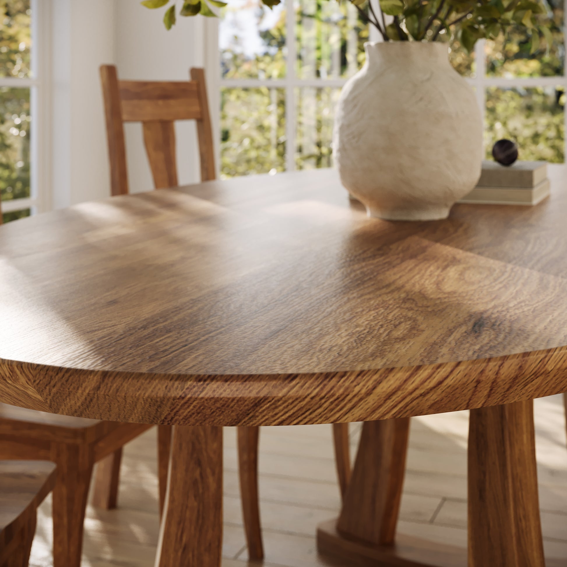 corner view of an oak oval dining table in a well lit dining room