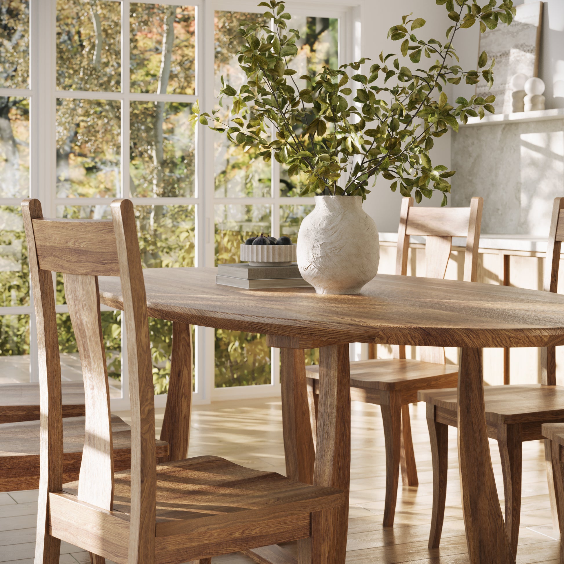 corner view of an oak oval dining table in a well lit dining room