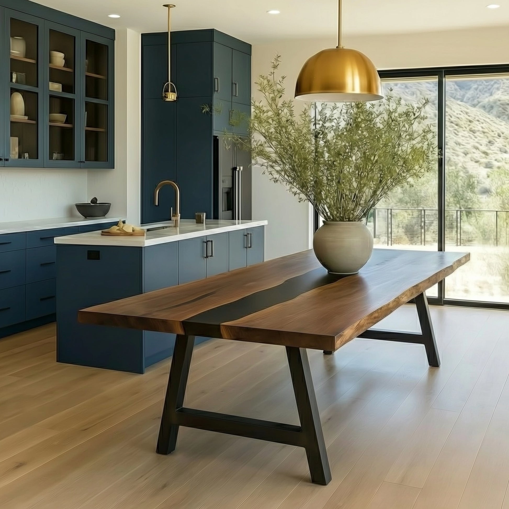 Modern kitchen with a wooden dining table and blue cabinets.