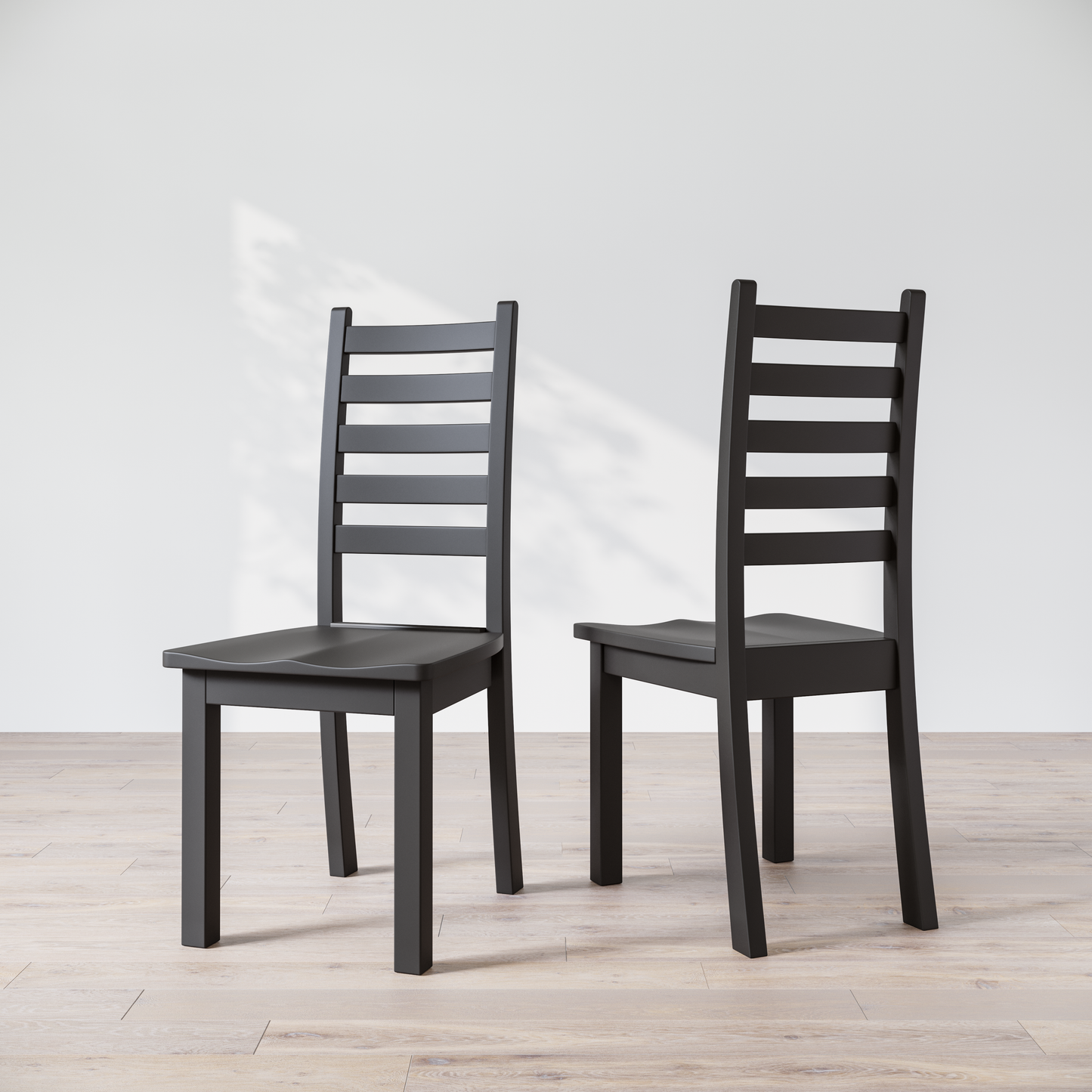 Two black wooden dining chairs with a commercial grade finish, displayed against a white background.