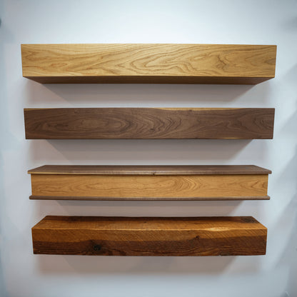 A variety of box mantels mounted on a white wall