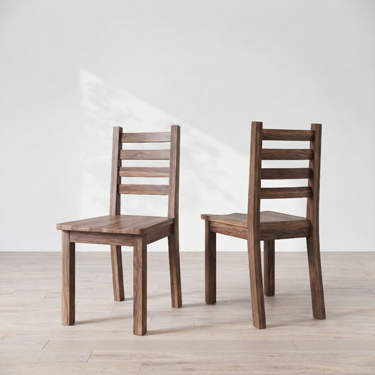Two wooden chairs on a light wooden floor with a white background