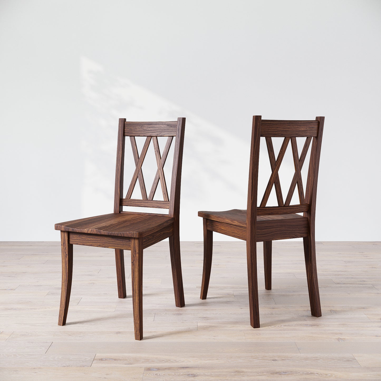 Two wooden dining chairs with a 'Double X Back' design, placed against a neutral background.