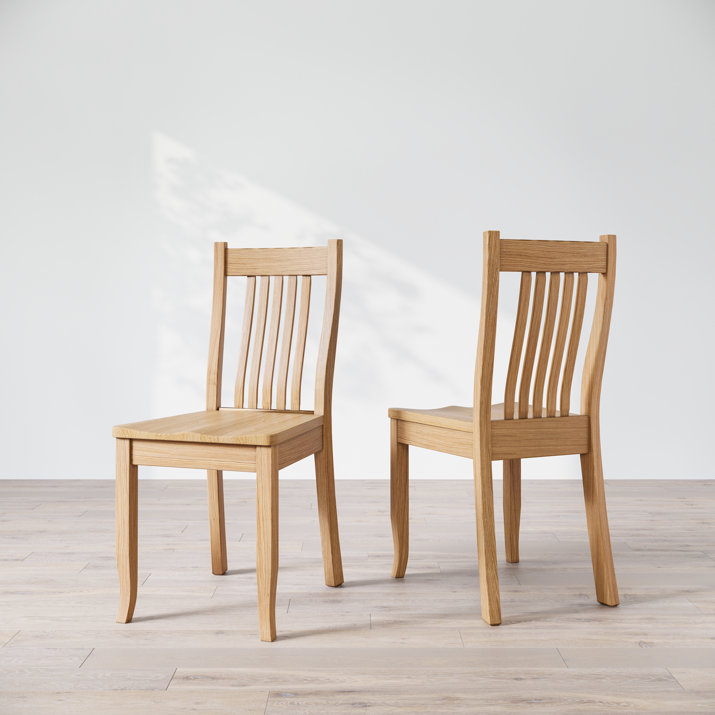 Two Oak wooden dining chairs, one facing forward and the other showing the side profile.