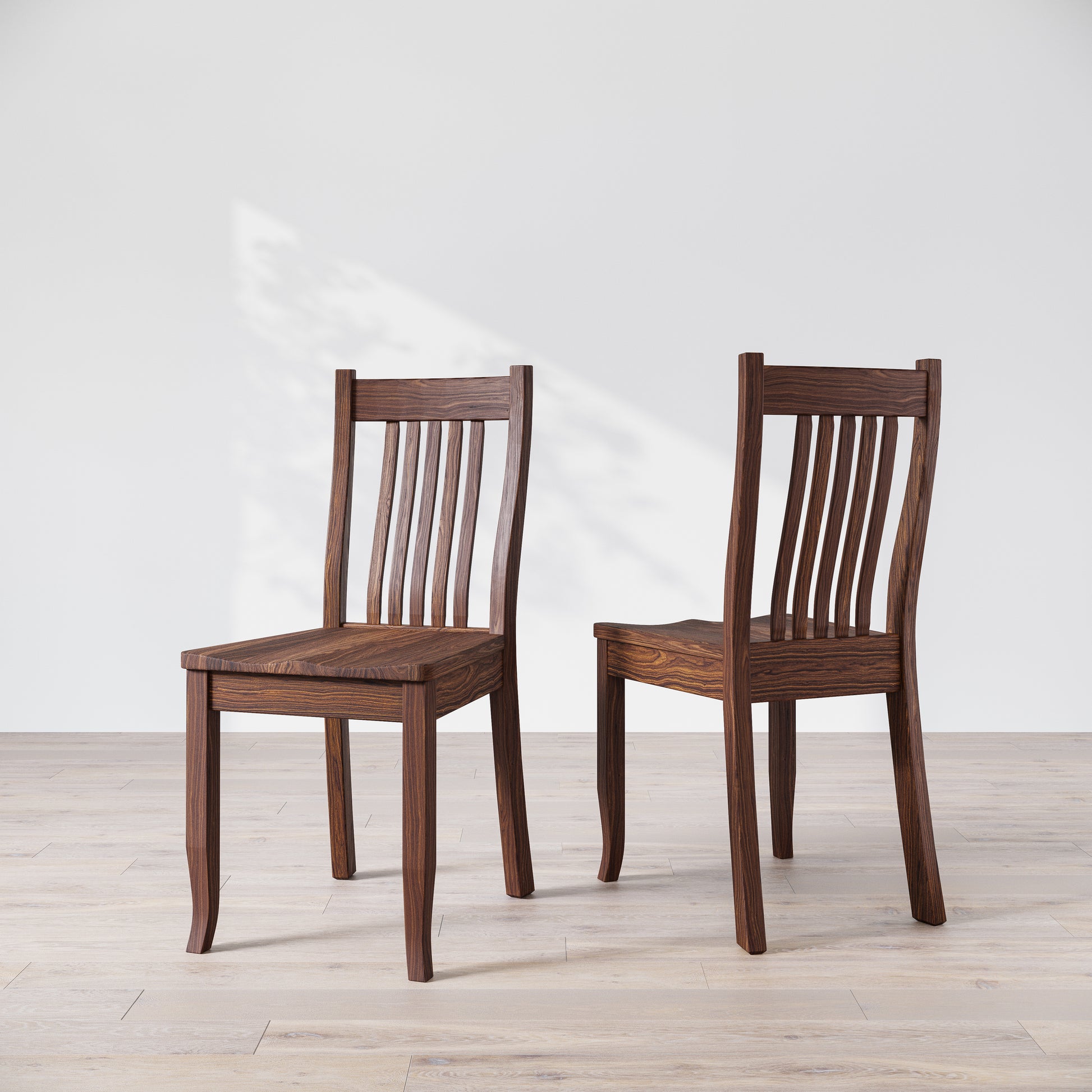 Two brown wooden dining chairs, one facing forward and the other showing the side profile.