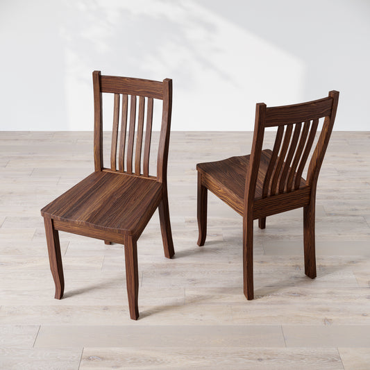 Angled top down view of two brown wooden dining chairs, one facing forward and the other showing the side profile.