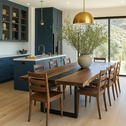 Modern kitchen with wooden dining table and chairs, featuring a large window view.