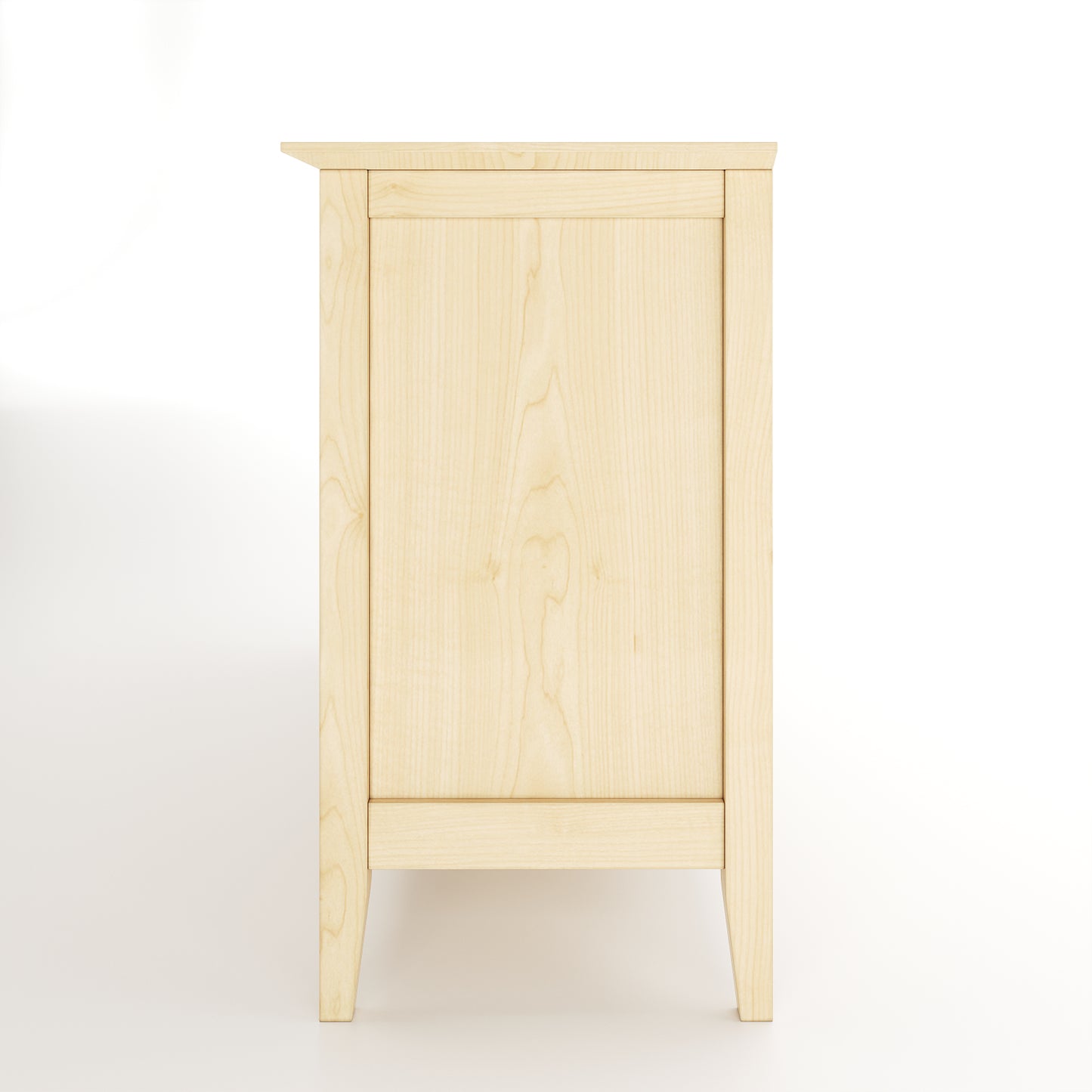 Side view of a maple dresser on white background