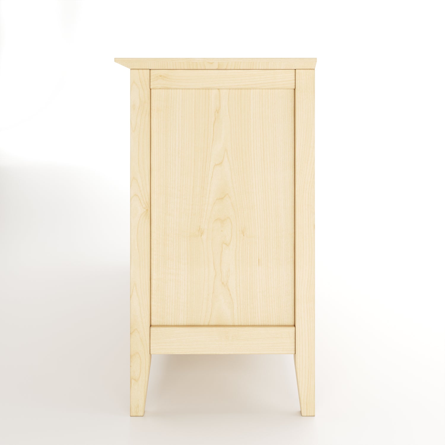 Side view of a maple dresser on white background