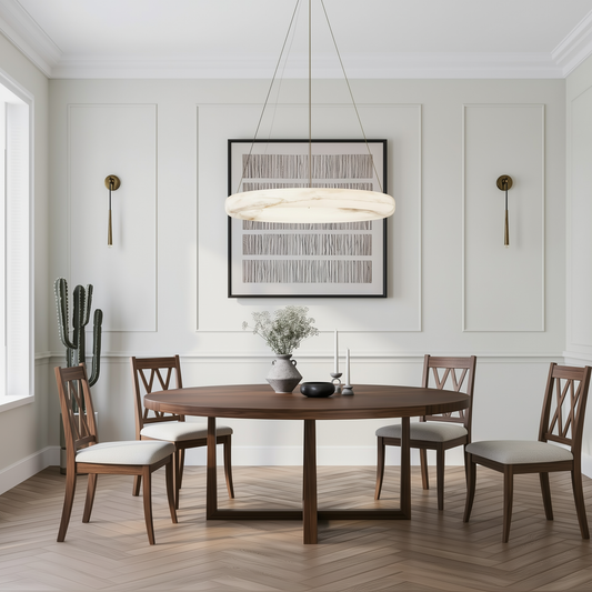 Dining room with wooden table and chairs, modern light fixture, and framed artwork on the wall.