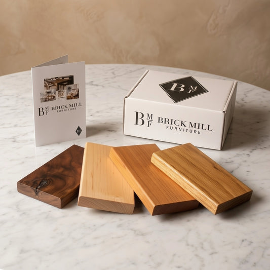 Wooden samples with a 'Brick Mill Furniture' box and leaflet on a marble surface.