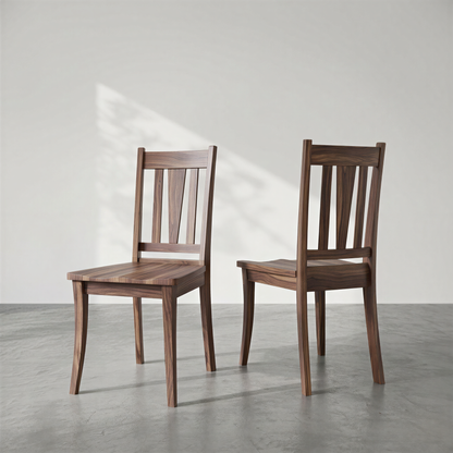 Two wooden chairs on a gray floor with a white wall background