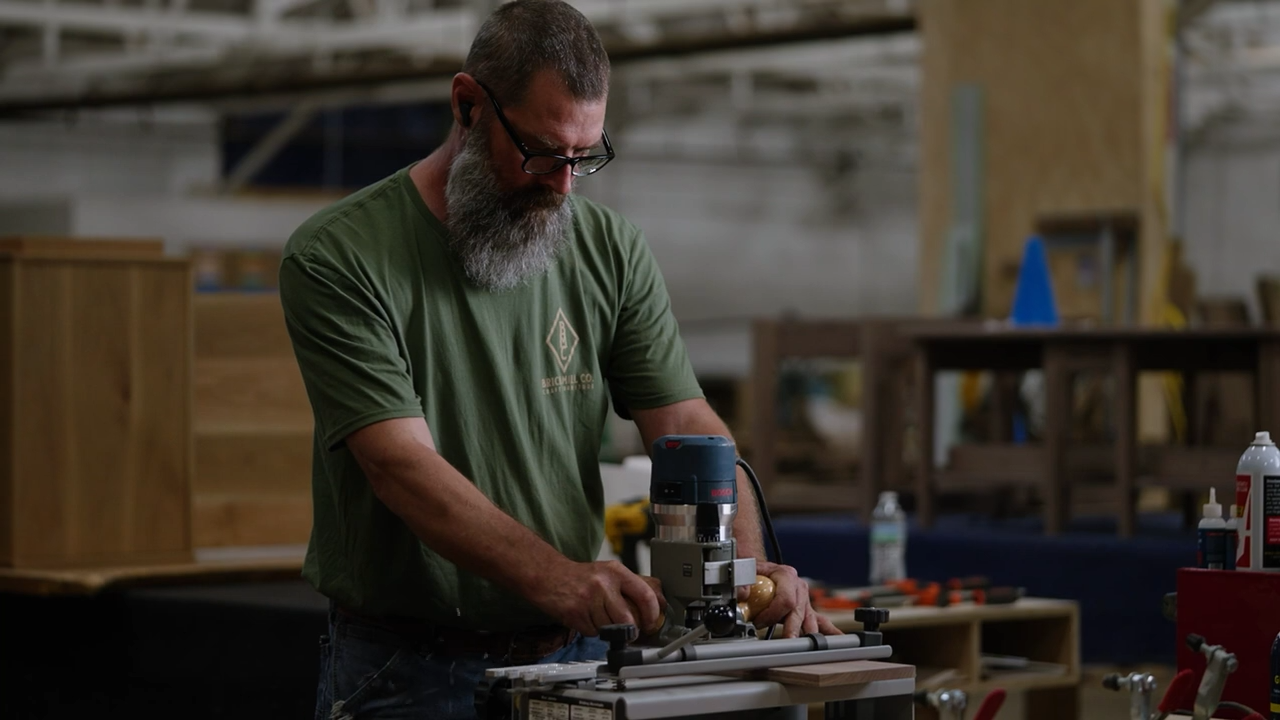 Man working with tools in a workshop setting
