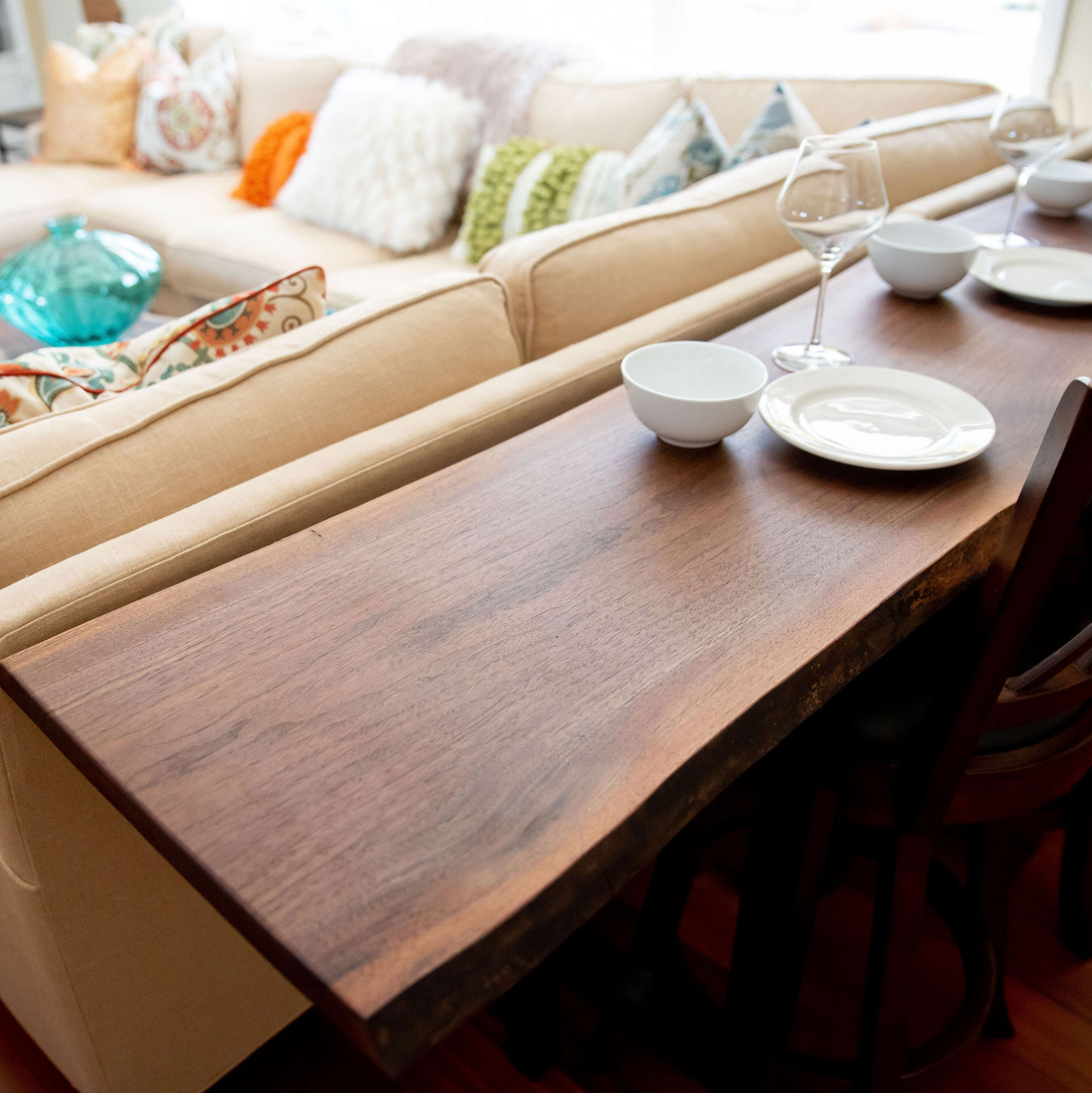Close up view of a live edge sofa table in a bright living room