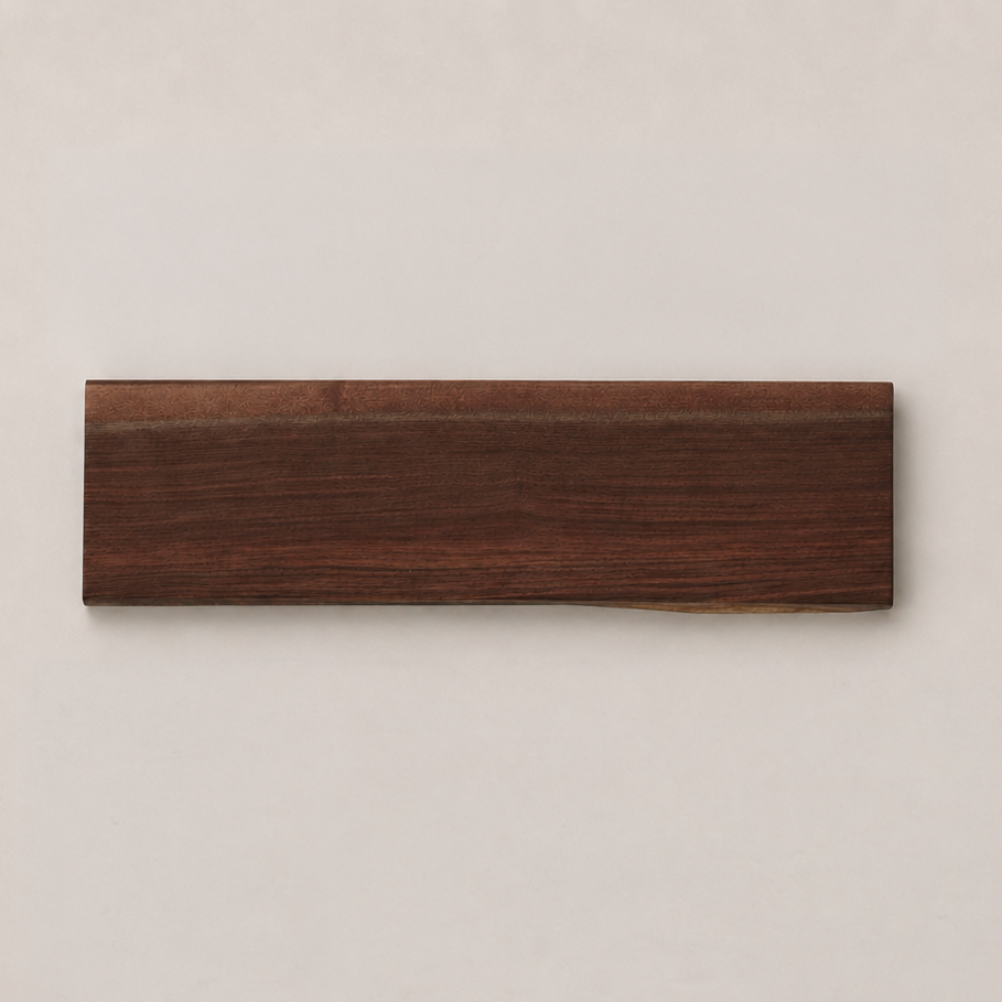 A rectangular dark brown wood slab with visible grain, displayed horizontally against a light beige background.