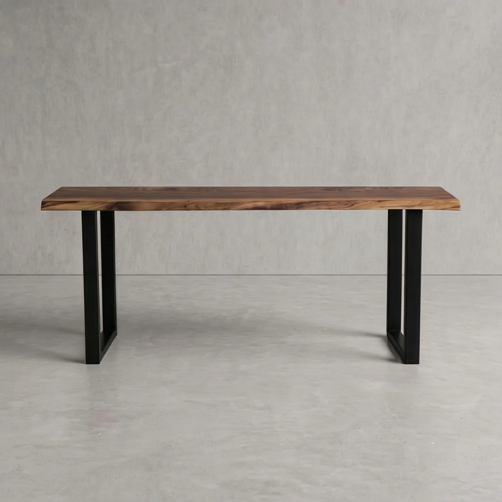 A rectangular wooden table with a live-edge natural wood top and black metal legs, shown against a neutral gray concrete-textured background.