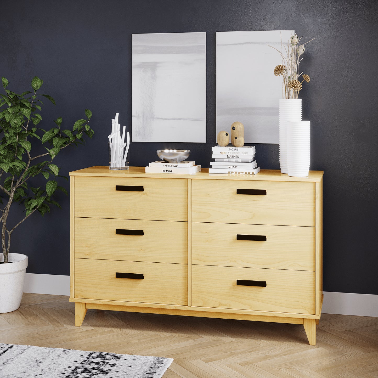 Wooden dresser with decorative items against a dark wall