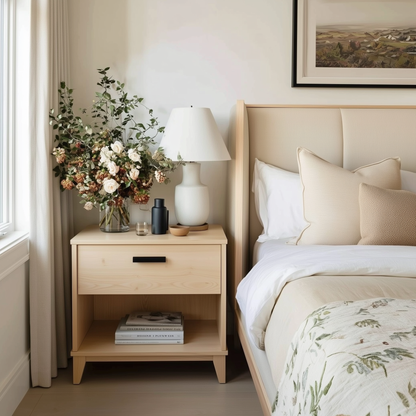 Neatly arranged bedroom with a bed, nightstand, and decorative elements.