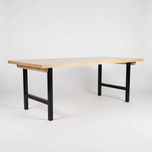 Wooden table with black legs on a white background