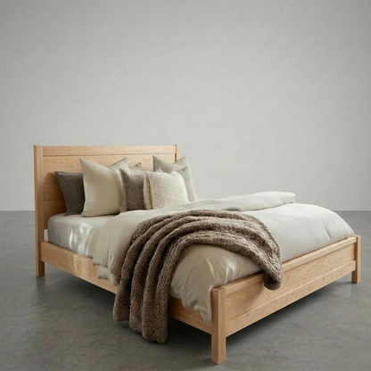 A wooden bed frame in a large empty room