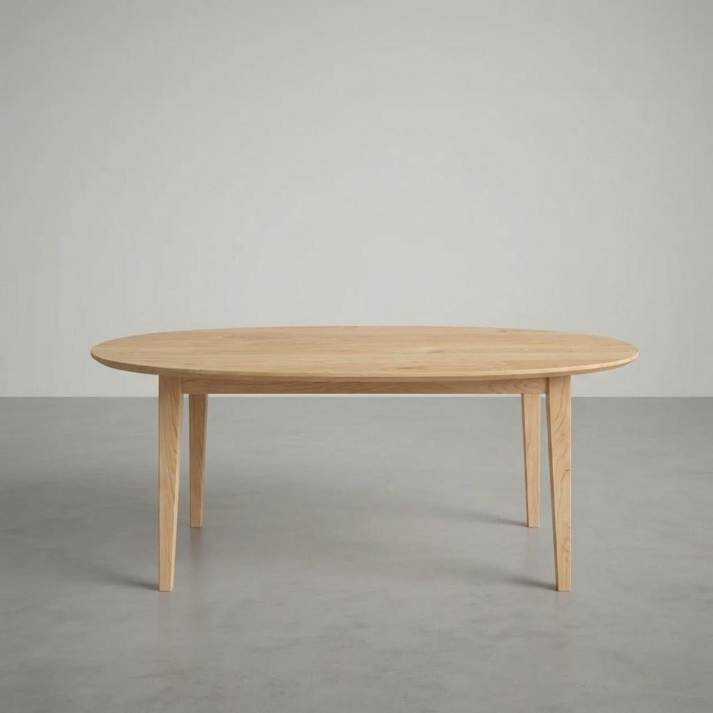 Wooden dining table on a plain gray background