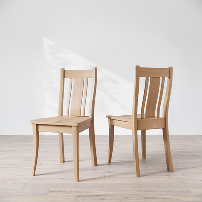 Two maple Shapleigh solid wood dining chairs in a studio setting
