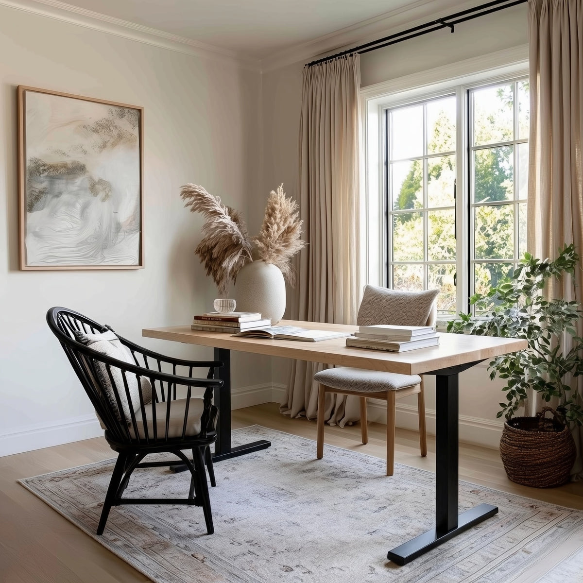 Home office with a maple standing desk, chairs, and decorative elements in a bright room.