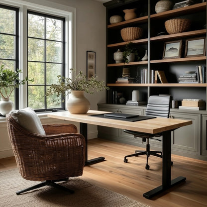 Home office with a maple standing desk, chair, and bookshelf.