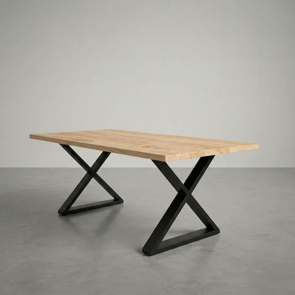 Wooden table with black metal legs on a gray floor and background