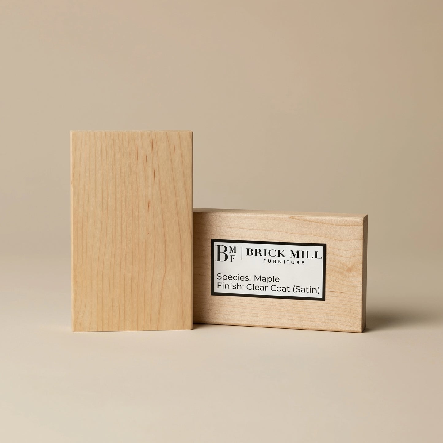 Wooden block with a clear coat finish on a beige background, featuring the Brick Mill Furniture logo.