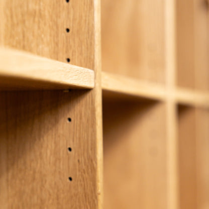 Close up view of shelves in an oak Ashbury  sectional bookcase