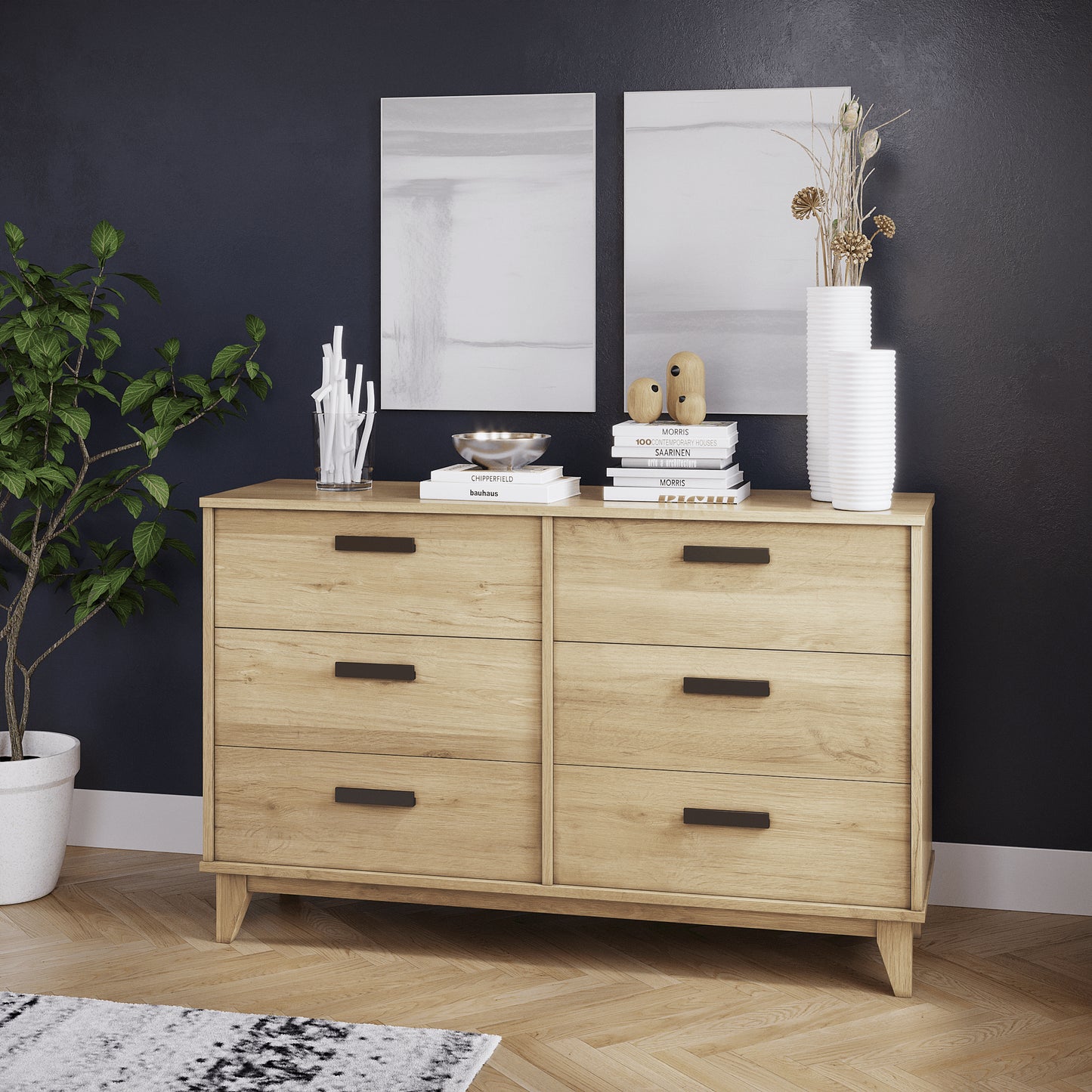 Wooden dresser with decorative items against a dark wall