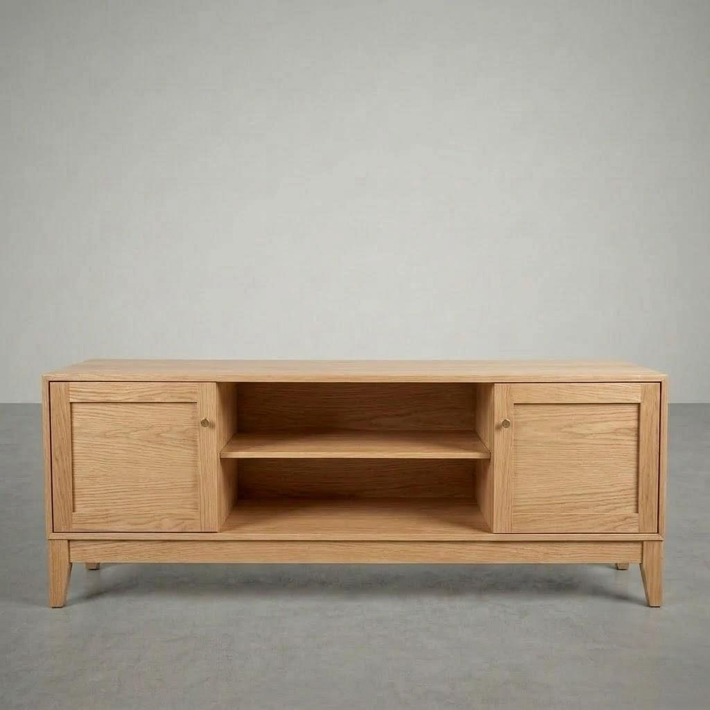 A light oak wood TV stand or media console with two cabinet doors and an open center shelf, photographed against a neutral gray studio background.