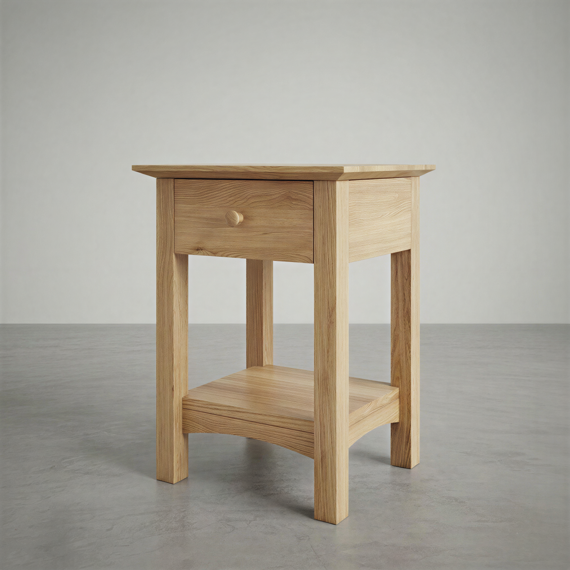 Wooden side table with a drawer on a gray floor and background