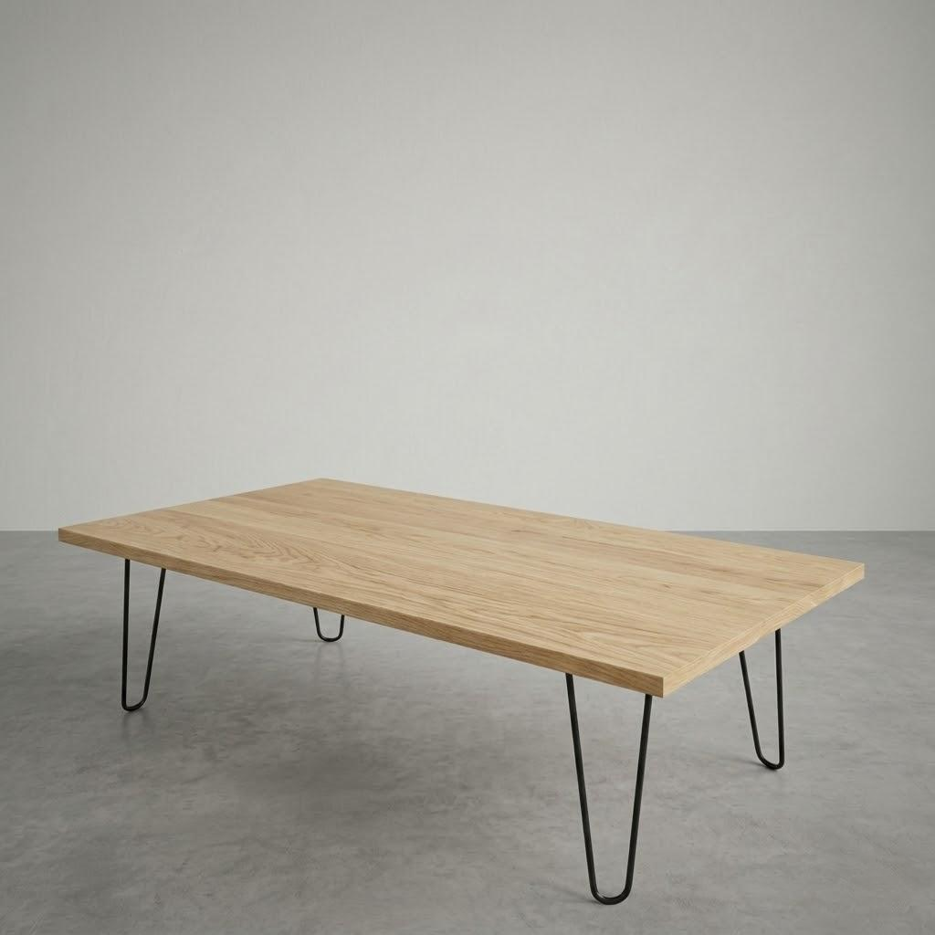Wooden table with black hairpin legs on a gray floor and background
