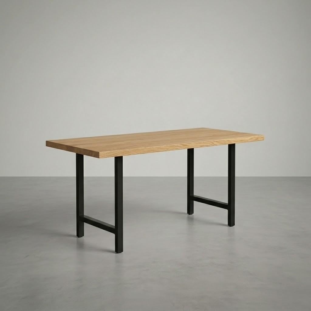 Wooden table with black metal legs on a gray floor and background