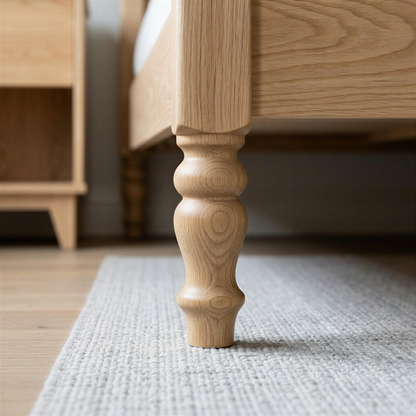 Wooden bed leg on a carpeted floor with a blurred background