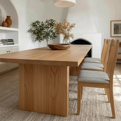 Close up view of a wooden dining table in a well furnished home