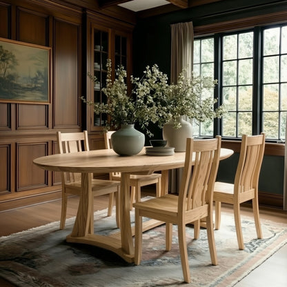 Dining room with wooden table and chairs, large windows, and decorative elements.