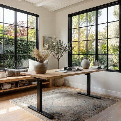 Modern home office with a wooden desk, large windows, and decorative elements.