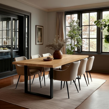 Dining room with a wooden table and chairs near large windows.