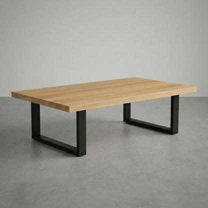 Wooden table with black metal legs on a gray floor and background