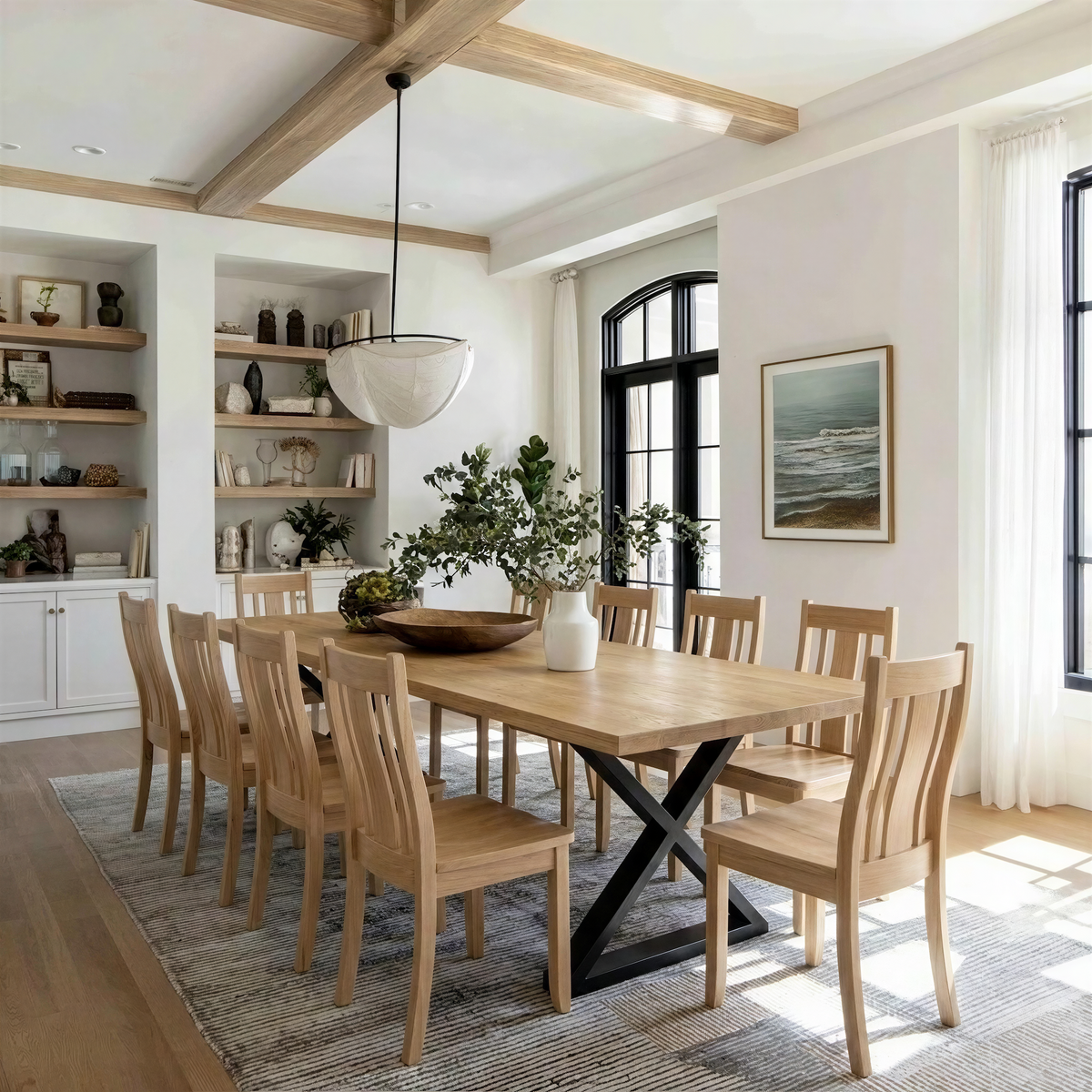 Dining room with wooden table and chairs, large window, and decorative elements.