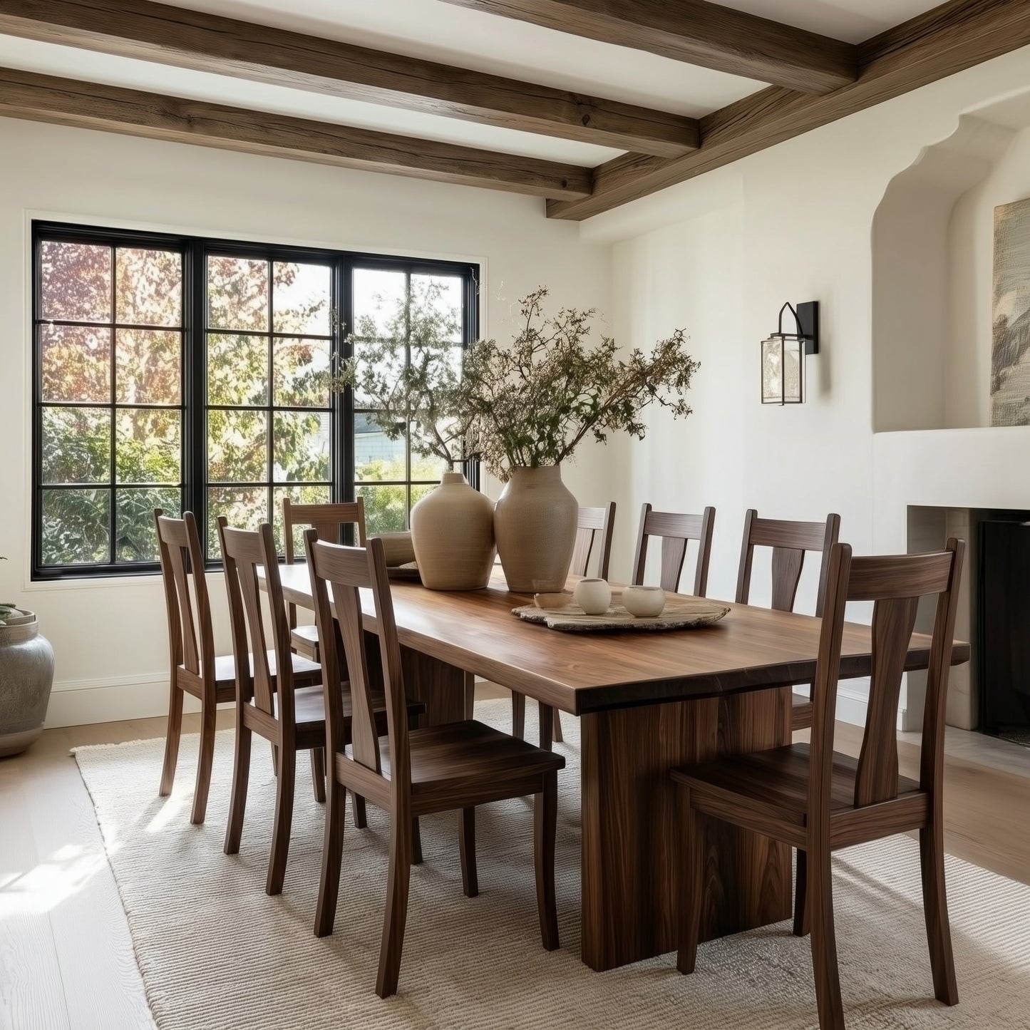 Dining room with wooden table and chairs, large window, and decorative elements.