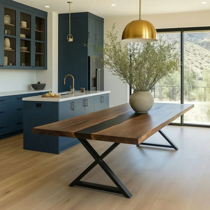 Modern kitchen with a long wooden dining table and blue cabinets.