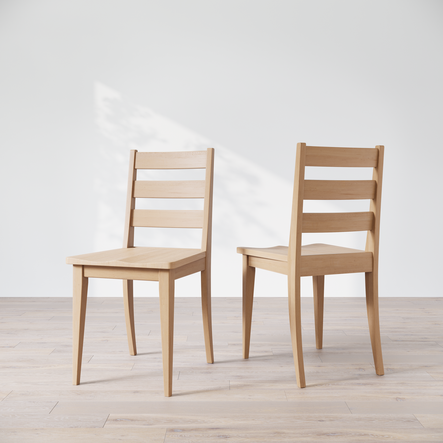 Two wooden dining chairs featuring a simple, solid backrest and seat design on a light background.